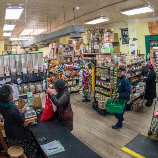 Workers and shoppers in grocery store